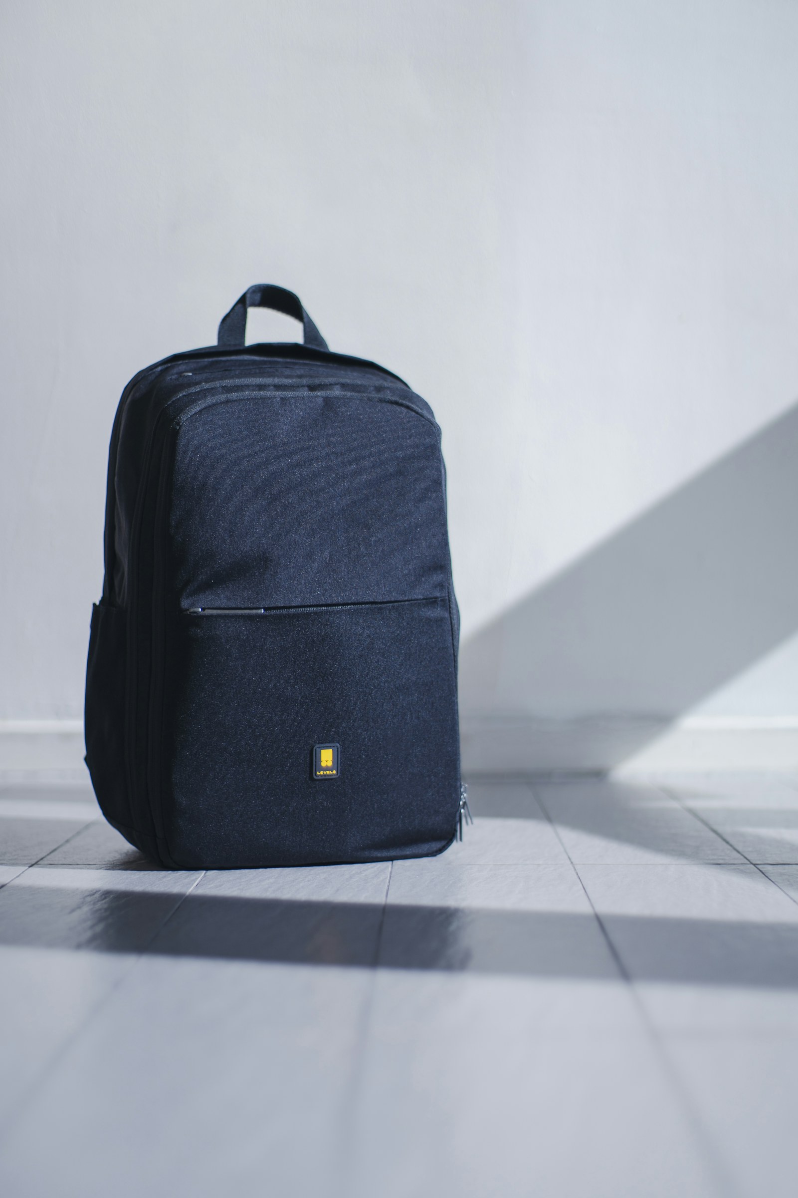 A navy backpack ready for a short trip